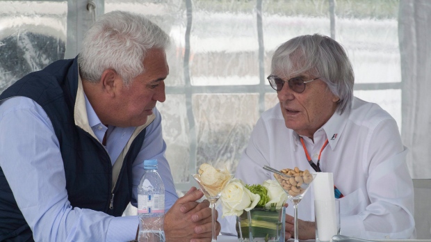 Montreal businessman Lawrence Stroll, left, chats