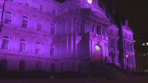 Montreal City Hall is lit up in purple