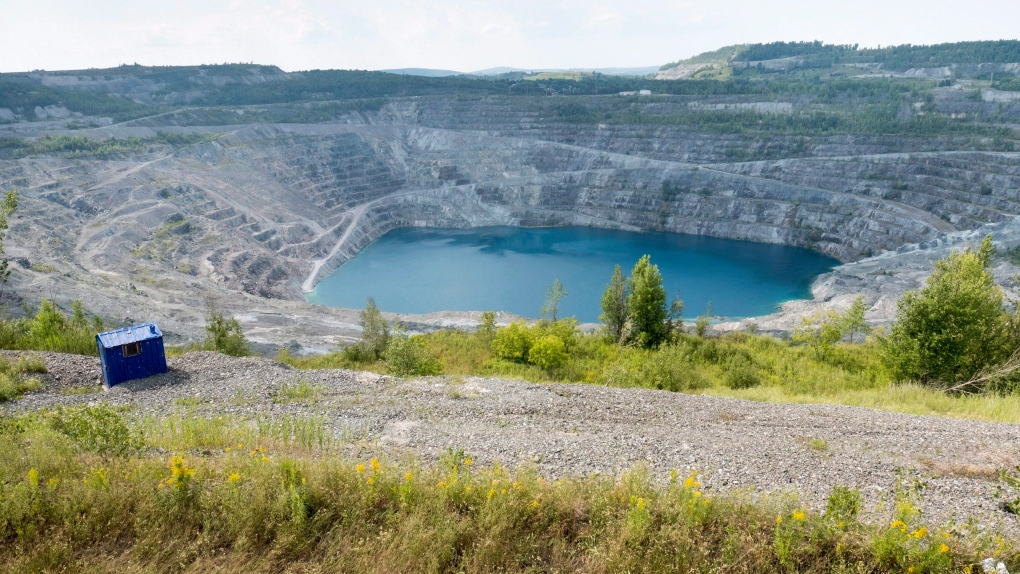 The open pit of the now closed Jeffrey mine is seen Wednesday, August 10, 2016 in Val-des-Sources, formerly known as Asbestos, Que. THE CANADIAN PRESS/Paul Chiasson