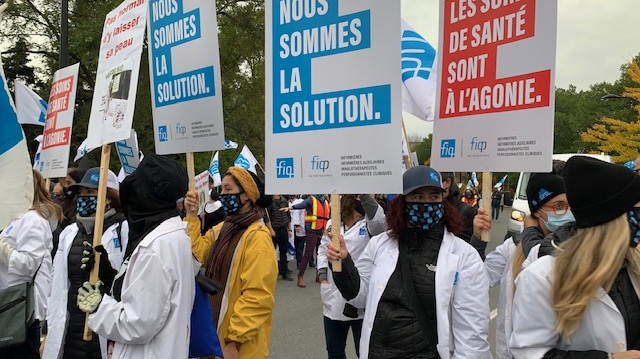 FIQ nurses march with signs on Oct. 19, 2020. (Photo/CTV News)