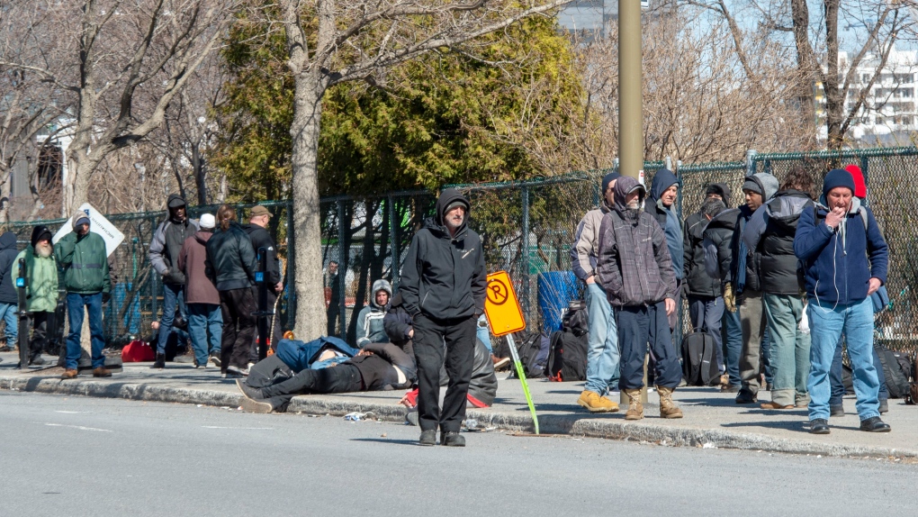 People lineup to get into a homeless shelter Tuesday March 31, 2020 in Montreal.THE CANADIAN PRESS/Ryan Remiorz