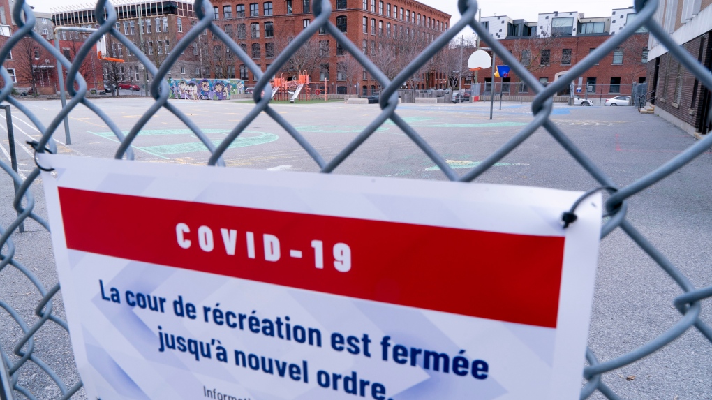 A closed schoolyard is seen through its fence in Montreal, Monday, April 27, 2020. Schools are again closed and set to reopen in Quebec Jan. 17, 2021. THE CANADIAN PRESS/Paul Chiasson