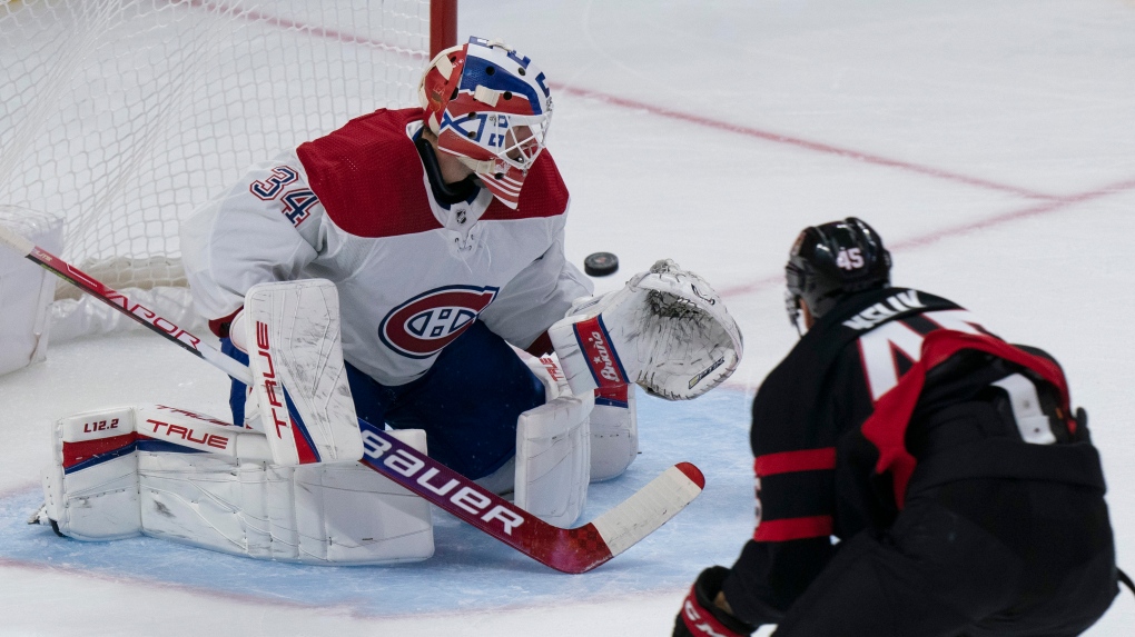 Ottawa Senators centre Parker Kelly watches his shot go wide of Montreal Canadiens goaltender Jake Allen during second period NHL preseason action, Friday, October 1, 2021 in Ottawa. THE CANADIAN PRESS/Adrian Wyld 