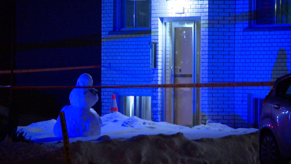 Police tape surrounds an apartment building on Duff Street in Pierrefonds after a man was shot on Thursday, Jan. 20, 2022. (Source: Cosmo Santamaria/CTV News)