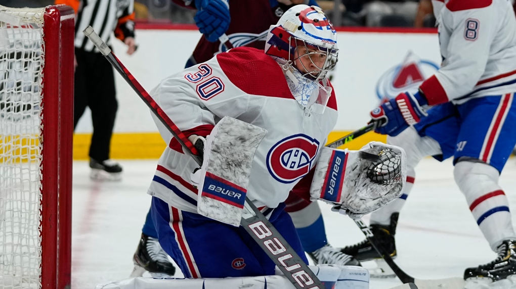 Montreal Canadiens goaltender Cayden Prime (30) makes a save against the Colorado Avalanche during the second period of an NHL hockey game Saturday, Jan. 22, 2022, in Denver. (AP Photo/Jack Dempsey) 