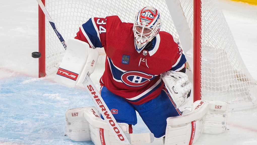 Montreal Canadiens goaltender Jake Allen makes a save during first period NHL pre-season hockey action against the Winnipeg Jets in Montreal, Thursday, September 29, 2022. THE CANADIAN PRESS/Graham Hughes