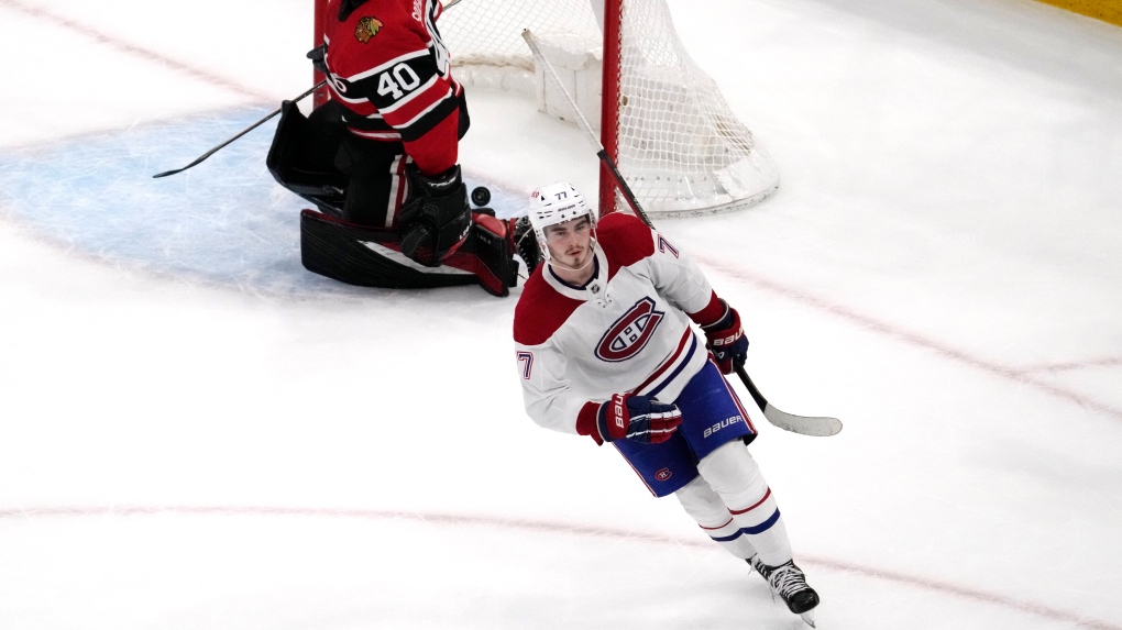 Montreal Canadiens centre Kirby Dach (77) skates after scoring a goal as Chicago Blackhawks goaltender Arvid Soderblom (40) reacts in a shootout of an NHL hockey game in Chicago, Friday, Nov. 25, 2022. (AP Photo/Nam Y. Huh)