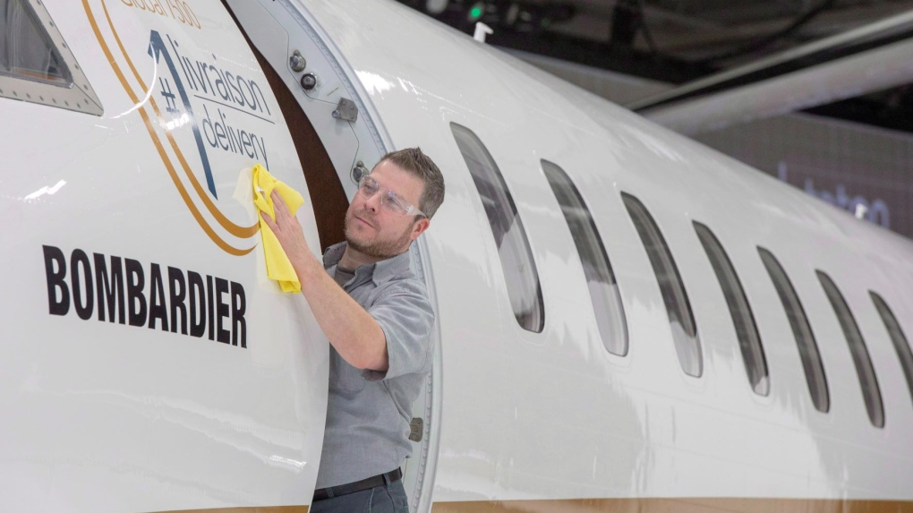 Francis Masse shine up Bombardier's new jetliner, the Global 7500, the longest-range business jet in the world at the company's finishing plant in Montreal, Wednesday, Dec. 19, 2018. THE CANADIAN PRESS/Ryan Remiorz