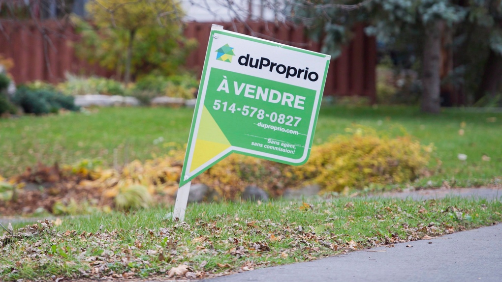 A home for sale sign is shown on the West Island of Montreal, Saturday, November 4, 2017. THE CANADIAN PRESS/Graham Hughes