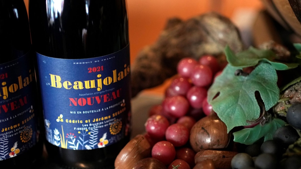 A Beaujolais Nouveau wine bottle is displayed in a restaurant of Boulogne Billancourt, outside Paris, Thursday, Nov. 18, 2021. Tannic acid is a naturally occurring polyphenol found in many beverages such as red wine and tea. (AP Photo/Christophe Ena)