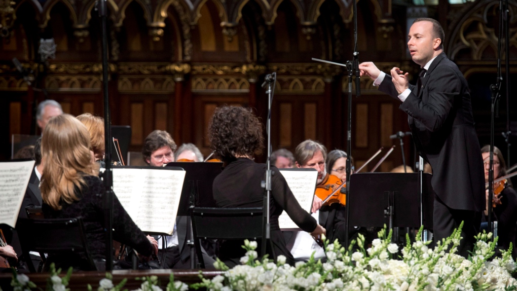 Yannick Nezet-Seguin conducts the Metropolitan Orchestra during a commemorative ceremony for businessman Paul Desmarais Tuesday, December 3, 2013 in Montreal. THE CANADIAN PRESS/Paul Chiasson 