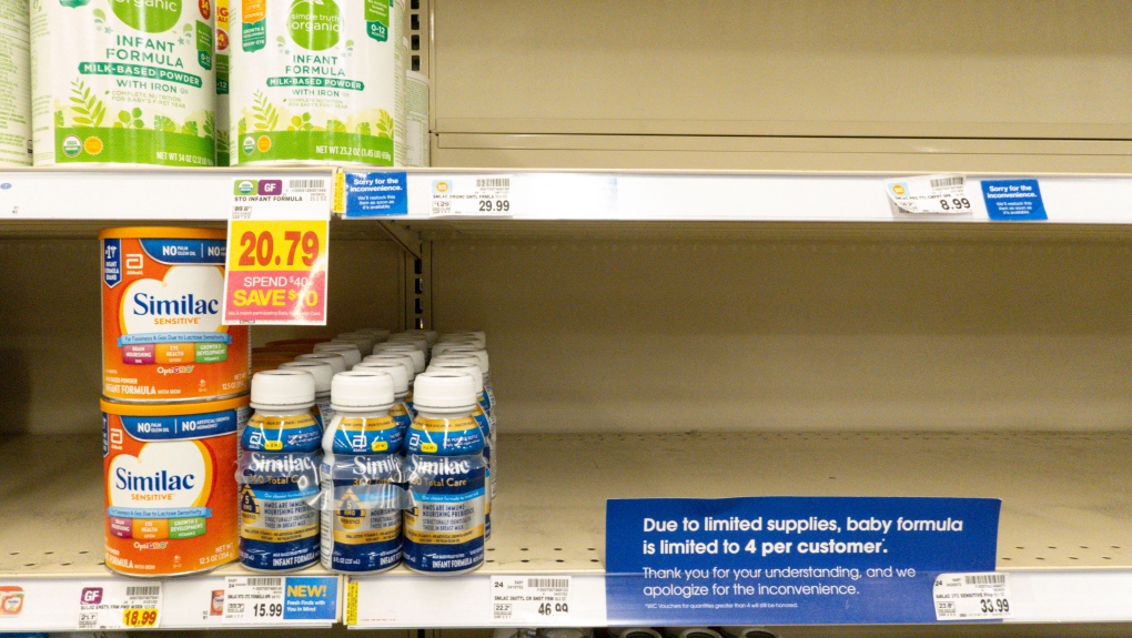 Baby formula is displayed on the shelves of a grocery store with a sign limiting purchases in Indianapolis, Tuesday, May 10, 2022. (AP Photo/Michael Conroy)