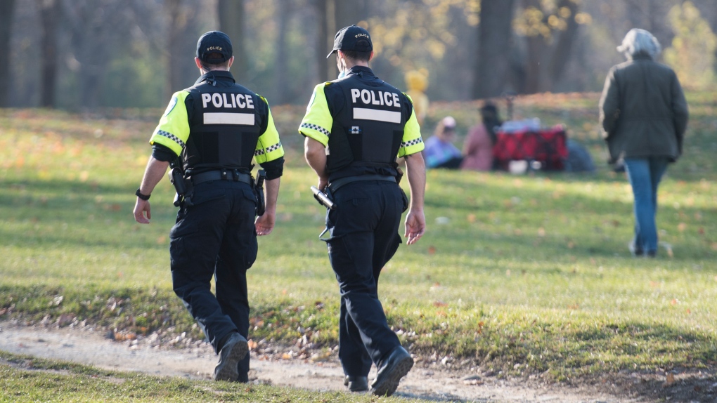 Police patrol Mount Royal park as people gather on a warm day. FILE PHOTO - THE CANADIAN PRESS/Graham Hughes