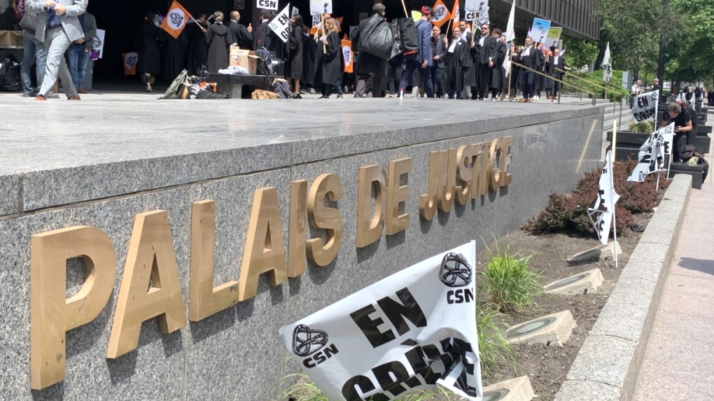 Legal aid lawyers hold a half-day strike as their contract negotiations are in a stalemate, in Montreal on Tuesday May 24, 2022. THE CANADIAN PRESS/Pierre St.Arnaud