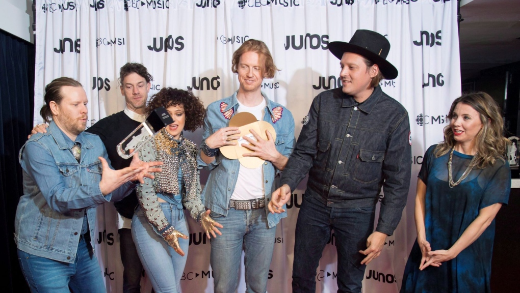 Arcade Fire celebrates their Juno for Album of the year at the Juno Awards in Vancouver, Sunday, March, 25, 2018. THE CANADIAN PRESS/Jonathan Hayward