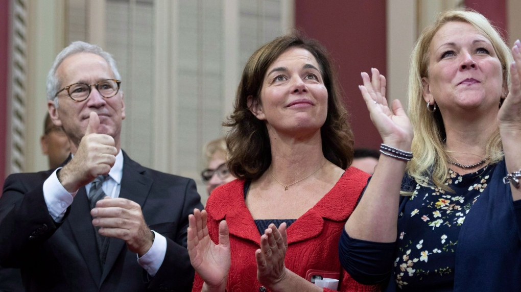 Quebec Liberal MNAs David Birnbaum, from the left, Paule Robitaille and Lise Theriault react to the applauds before being sworn in as member of the National Assembly Monday, October 15, 2018 at the legislature in Quebec City. Robitaille announced on social media she will not seek re-election in the October 2022 provincial election. THE CANADIAN PRESS/Jacques Boissinot
