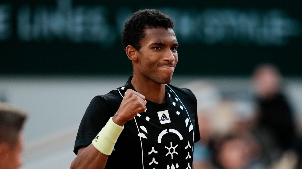 Canada's Felix Auger-Aliassime clenches his fist after scoring a point against Spain's Rafael Nadal during their fourth round match at the French Open tennis tournament in Roland Garros stadium in Paris, France, Sunday, May 29, 2022. (AP Photo/Thibault Camus