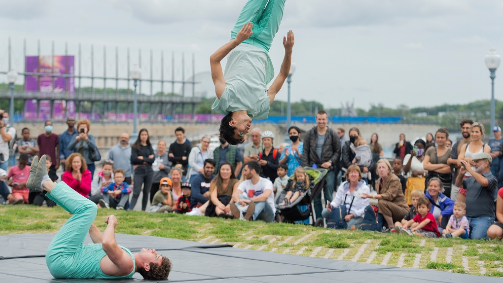 Cirque Eloize performers entertain the crowd in the Old Port in Montreal, Sunday, Aug. 1, 2021. THE CANADIAN PRESS/Graham Hughes