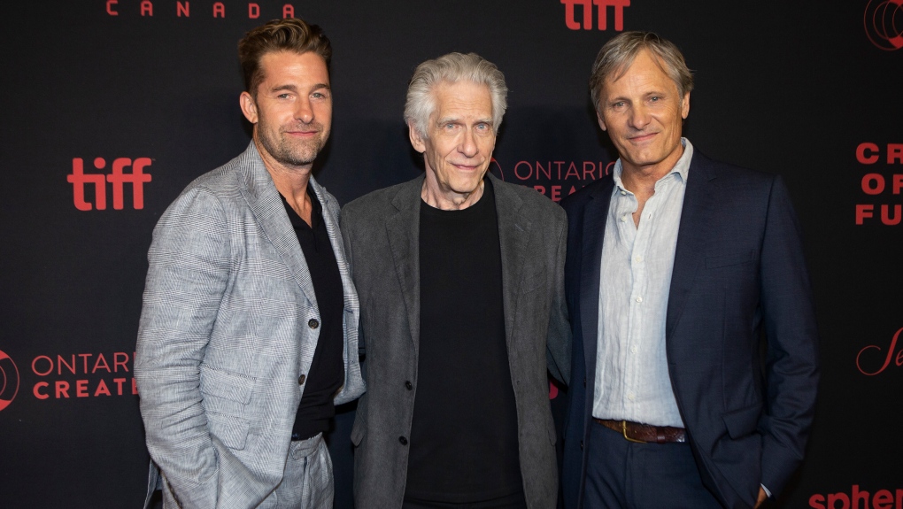 Director David Cronenberg, centre, stands on the red carpet with actors Viggo Mortensen, right, and Scott Speedman, for the North American premiere of "Crimes of the Future", in Toronto, Monday, May 30, 2022. THE CANADIAN PRESS/Chris Young