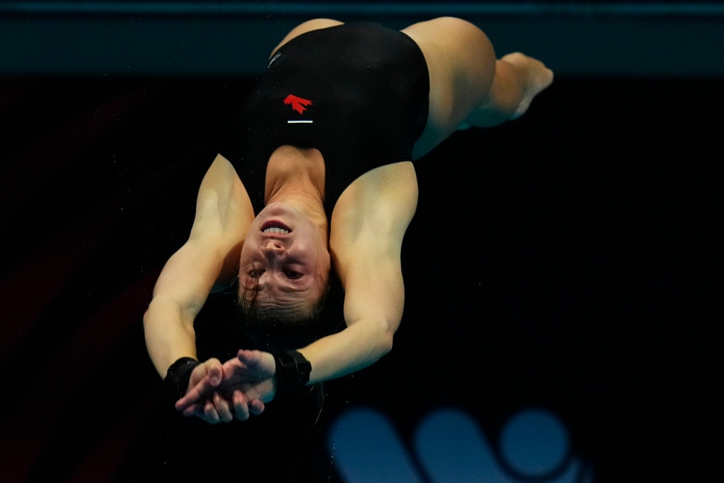 Mia Vallee of Canada competes during the women's diving 3m springboard semifinal at the 19th FINA World Championships in Budapest, Hungary, Friday, July 1, 2022. (AP Photo/Petr David Josek)