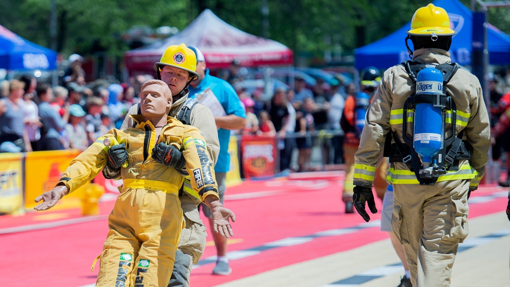 Firefighters compete in the Firefit Championships in Montreal, Sunday, July 3, 2022. THE CANADIAN PRESS/Graham Hughes
