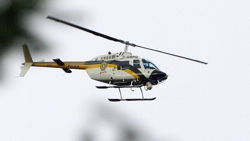 FILE - A Surete du Quebec helicopter. THE CANADIAN PRESS/Sean Kilpatrick
