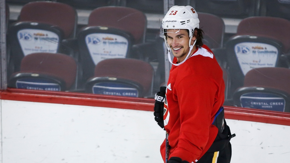 Calgary Flames' Sean Monahan laughs as he skates during practice in Calgary, Monday, July 13, 2020.THE CANADIAN PRESS/Jeff McIntosh