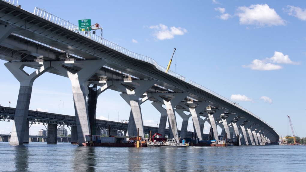 A recently released Quebec coroner report says that Montreal's Champlain Bridge needs to improve its safety barrier, after a 38-year-old man jumped to his death from the structure in May 2022. The Samuel de Champlain bridge is seen with the old bridge in the background in Montreal on Monday, June 17, 2019. THE CANADIAN PRESS/Paul Chiasson