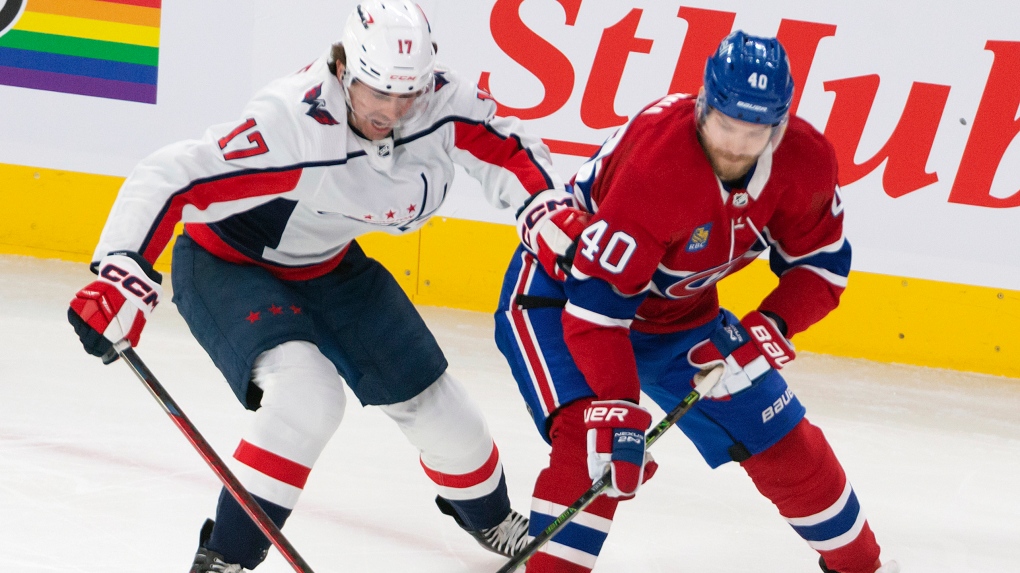 Washington Capitals' Dylan Strome (17) and Montreal Canadiens' Joel Armia (40) battle for the puck during first period NHL hockey action in Montreal, Thursday April 6, 2023. THE CANADIAN PRESS/Peter McCabe
