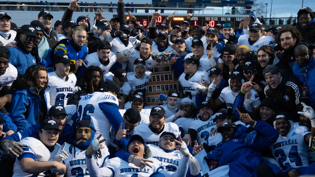 Members of the Montreal Carabins celebrate with the Vanier Cup, Saturday, Nov. 25, 2023 in Kingston, Ont. The Carabins defeated the UBC Thunderbirds 16-9 to win the Canadian University Football Championship. THE CANADIAN PRESS/Adrian Wyld