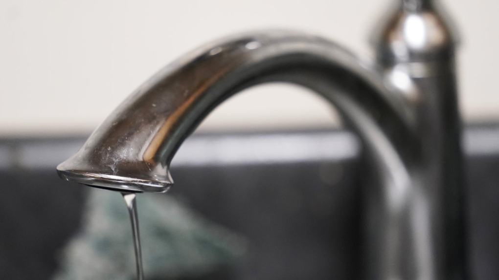 A trickle of water comes out of the faucet of Mary Gaines a resident of the Golden Keys Senior Living apartments in her kitchen in Jackson, Miss., Thursday, Sept. 1, 2022. (AP Photo/Steve Helber)