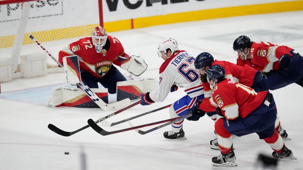 Montreal Canadiens center Chris Tierney (67) shoots on Florida Panthers goaltender Sergei Bobrovsky (72) under pressure from Florida Panthers defense during the second period of an NHL hockey game, Thursday, March 16, 2023, in Sunrise, Fla. (AP Photo/Rebecca Blackwell)