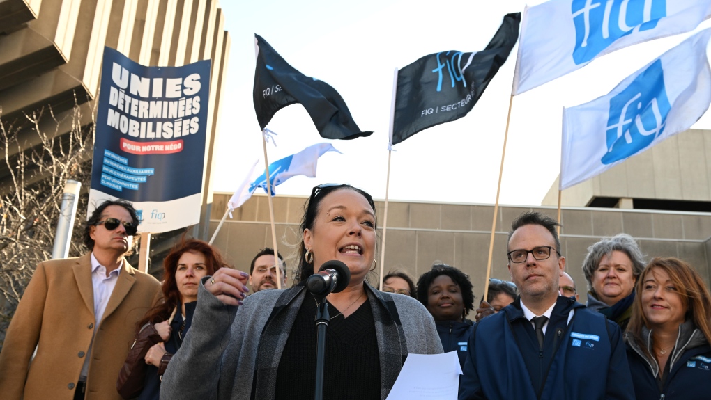 Quebec nurses union (FIQ) president Julie Bouchard speaks to members before presenting their demands for a new contract negotiation, Monday, November 7, 2022 at the Treasury Board building in Quebec City. THE CANADIAN PRESS/Jacques Boissinot