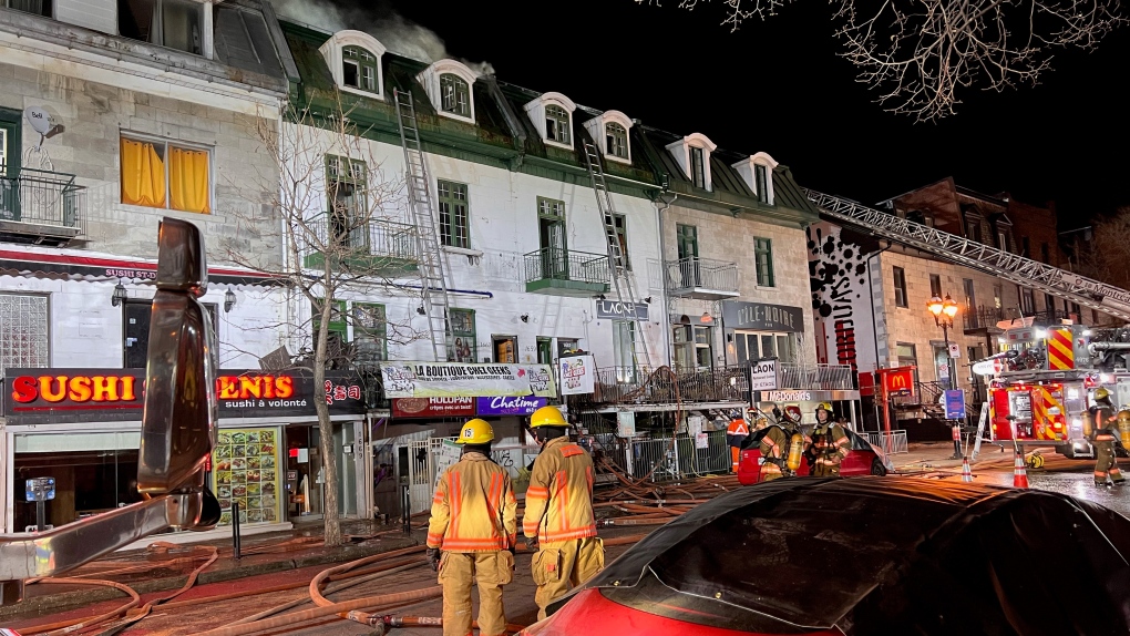 Firefighters were called to a burning building on St-Denis Street around 1:30 a.m. on March 20, 2023. (CTV News/Cosmo Santamaria)
