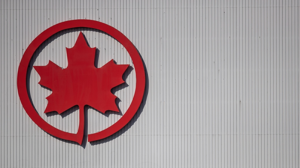 The Air Canada logo is seen on a hangar at Vancouver International Airport, in Richmond, B.C., on Friday, March 20, 2020. THE CANADIAN PRESS/Darryl Dyck