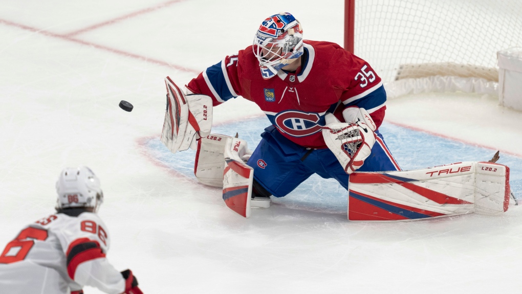 Montreal Canadiens goaltender Sam Montembeault (35) makes a save after losing his stick during first period NHL preseason hockey action against New Jersey Devils in Montreal on Monday, Sept. 25, 2023. THE CANADIAN PRESS/Christinne Muschi