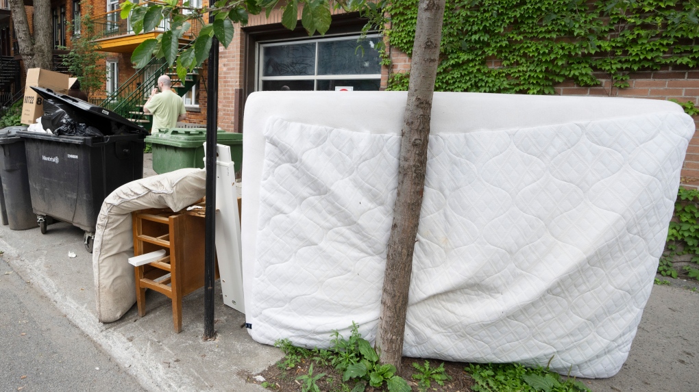 Discarded household items left on the sidewalk wait to be picked up after last weekend’s moving day, in Montreal, Tuesday, July 4, 2023. THE CANADIAN PRESS/Ryan Remiorz
