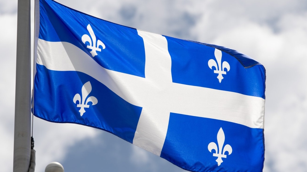 Quebec's provincial flag flies on a flag pole in Ottawa, Friday, July 3, 2020. A nurses union in Quebec's Gaspésie region says the local health care network is discriminating against francophone personnel with bilingualism requirements in several job postings.THE CANADIAN PRESS/Adrian Wyld