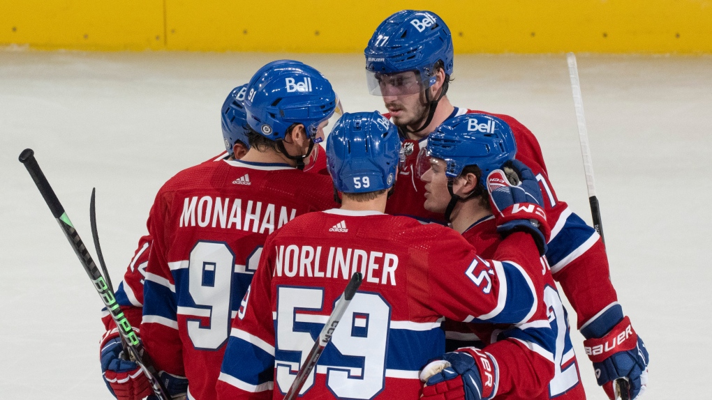 Montreal Canadiens Cole Caufield (22) celebrates his game winning goal against the Ottawa Senators with teammates during third period NHL preseason hockey action in Montreal, Wednesday, Sept. 27, 2023. THE CANADIAN PRESS/Christinne Muschi