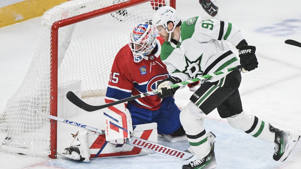 Dallas Stars' Tyler Seguin (91) scores against Montreal Canadiens goaltender Sam Montembeault during second period NHL hockey action in Montreal, Saturday, Feb. 10, 2024. THE CANADIAN PRESS/Graham Hughes
