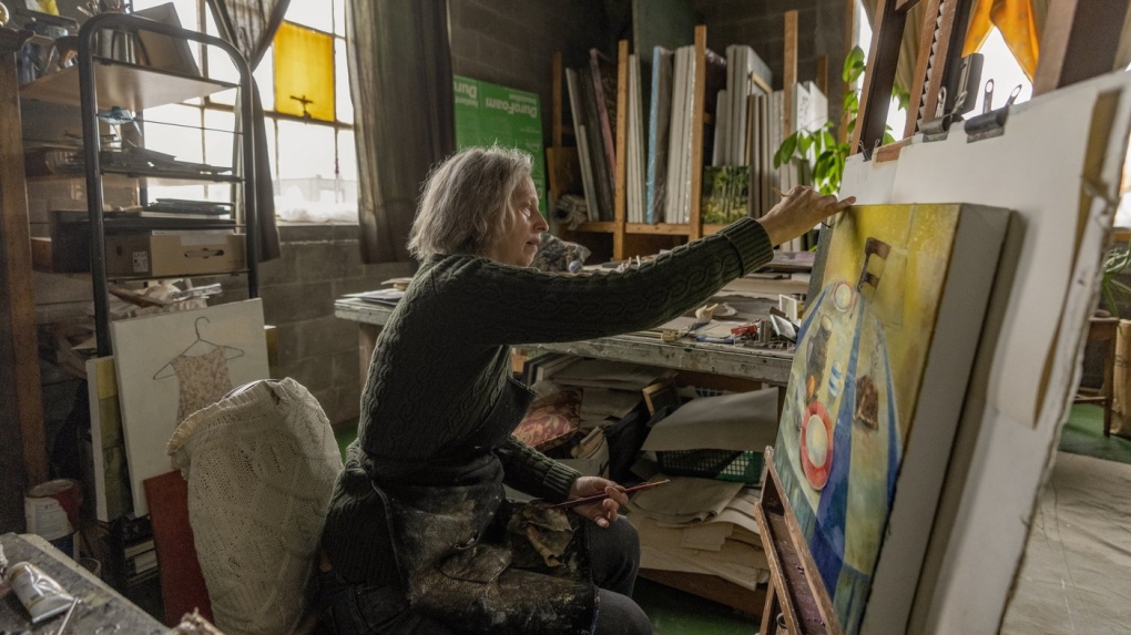 Artist Frances Foster works in her home in Montreal, Friday, Feb. 9, 2024. THE CANADIAN PRESS/Christinne Muschi