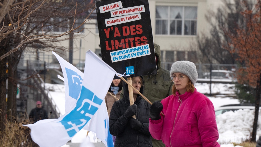 Union members with the FIQ demonstrate in Montreal on Dec. 11, 2023. (Ryan Remiorz, The Canadian Press)