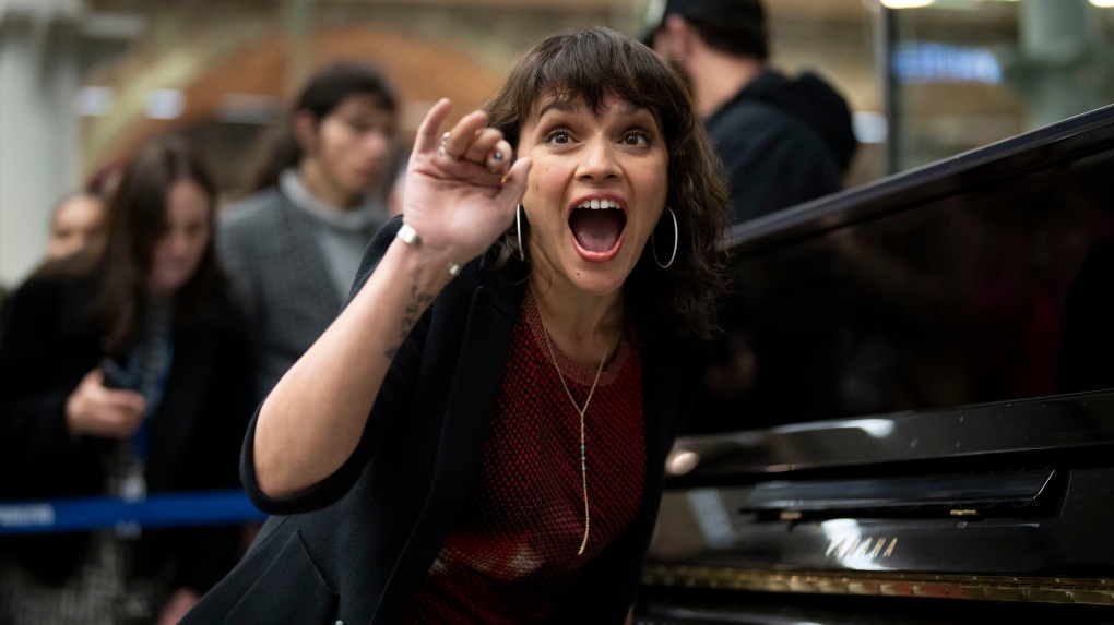 Norah Jones performs during a surprise performance at Kings Cross station in London, Wednesday, March 13, 2024. (Photo by Scott Garfitt/Invision/AP)