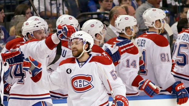 Desharnais is congratulated by teammates
