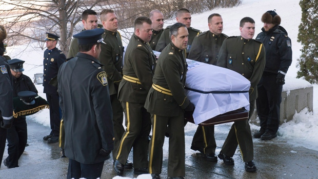 The casket of police officer Thierry LeRoux