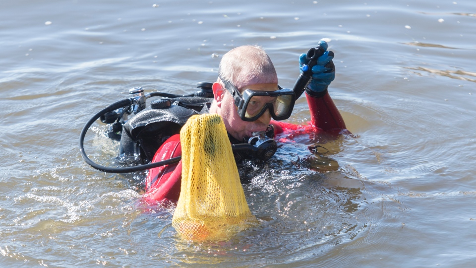 Diver cleaning up the St. Larence River