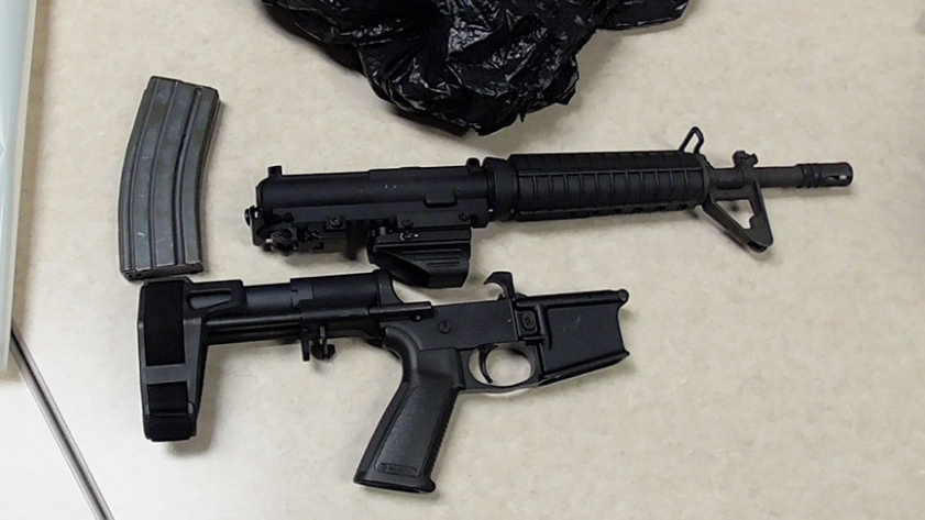 A gun and clip seized in raid